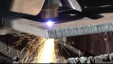 Hot CNC machine plasma cuts creating bright sparks closeup Stock Footage 118581621