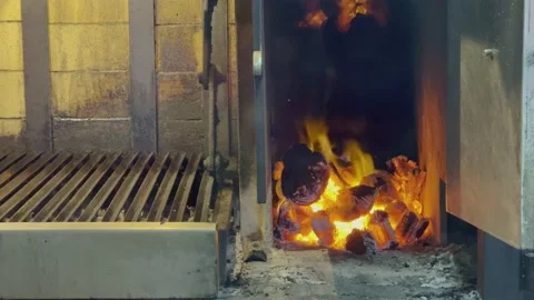 Hot coal in fire in argentinian grill at Restaurant 4k Stock Footage 218263312