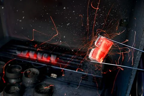 Hot coal for hookah. Stock Photos