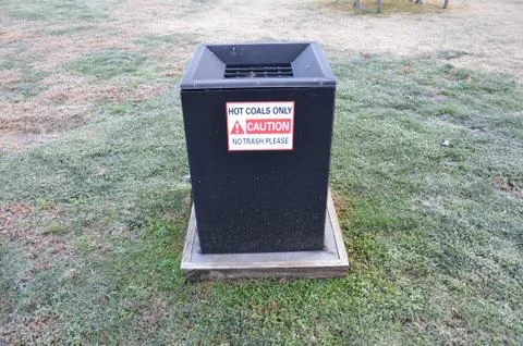 Hot coals only caution no trash please sign Stock Photos