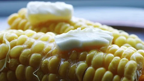 Hot cob of boiled corn with butter. 動画素材 76942800
