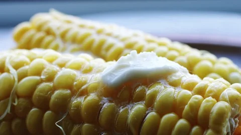 Hot cob of boiled corn with butter and salt. Stock Footage 76943040
