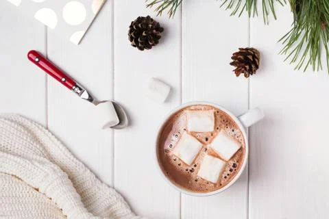 Hot cocoa with marshmallows on white table Stock Photos