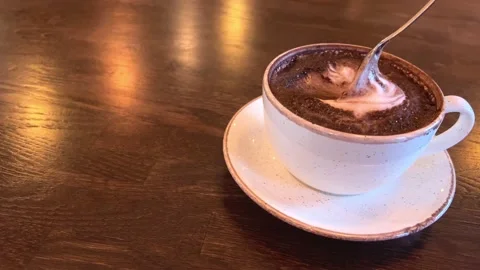 Hot cocoa in a white cup on a dark wooden table Stock Footage 172218028