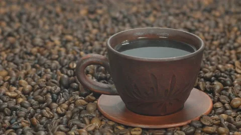 Hot coffee on the background of coffee beans Stock Footage 108611169