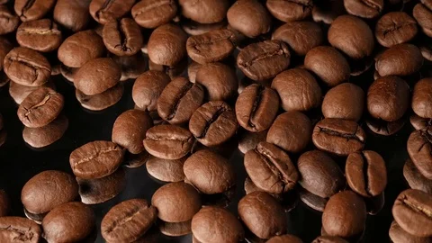 Hot coffee beans close-up with mirror reflection, with smoke Stock Footage 74775406