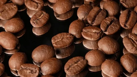 Hot coffee beans close-up with mirror reflection, with smoke Stock Footage 74775434