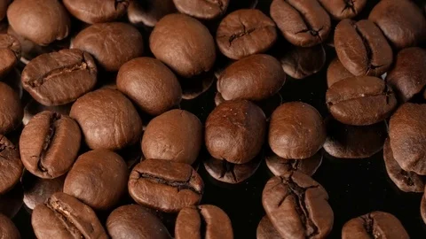 Hot coffee beans close-up with mirror reflection, with smoke Stock Footage 74775538