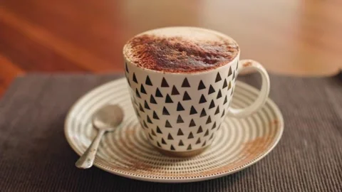 Hot coffee being served in a white mug Stock Footage 246655517