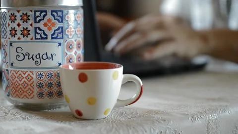 Hot coffee beverage and a worker typing on his laptop Video stock 196694826