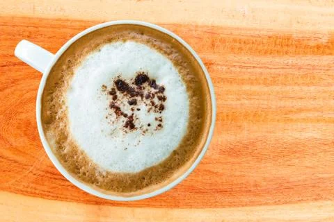 Hot coffee cup with clipping path top view on wood plank Stock Photos