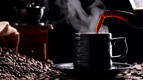 Hot Coffee Cup. Close-up pouring coffee into ceramic black mug Stock Footage 223422681