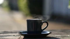 Hot Coffee Mug Closeup Natural Steam Smoke Of Coffee From Hot Coffee Cup On  Old Wooden Table In Morning Warm Sunshine Flare Outdoor View Background  Concept Hot Drink Espresso Breakfast Stock Photo 