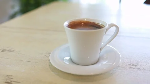 Hot Coffee Cup With Steam On Table In Cafe Stock Footage 125750178
