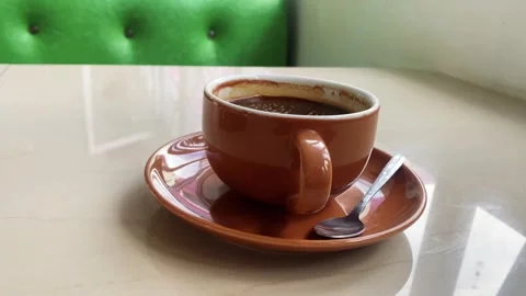 Hot Coffee Cup on White Ceramic Table in Cafe Setting Stock Footage 319084674