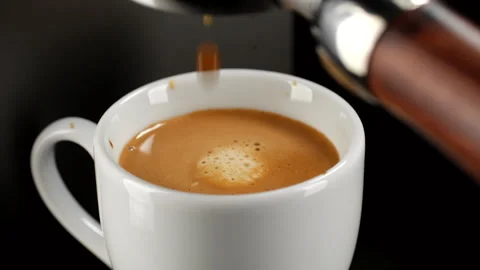 Hot coffee espresso from coffee machine pour in white cup Stock-Footage 249499614