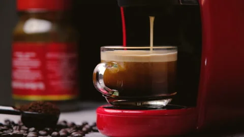 Hot coffee flows into a cup with an espresso machine, close-up. Stock Footage 219996352