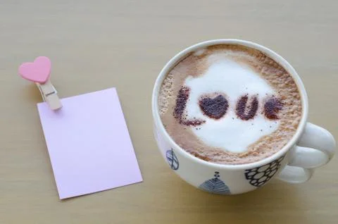 Hot coffee with foam milk art love pattern Stock Photos