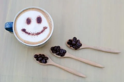 Hot coffee with foam milk art smile pattern Stock Photos