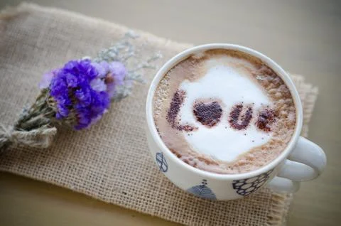 Hot coffee with foam milk art love pattern Stock Photos