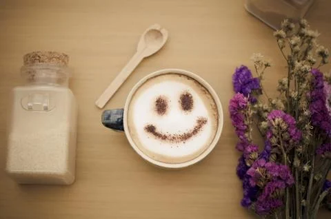 Hot coffee with foam milk art smile pattern Stock Photos