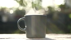 Hot Coffee Mug Closeup Natural Steam Smoke Of Coffee From Hot Coffee Cup On  Old Wooden Table In Morning Warm Sunshine Flare Outdoor View Background  Concept Hot Drink Espresso Breakfast Stock Photo 