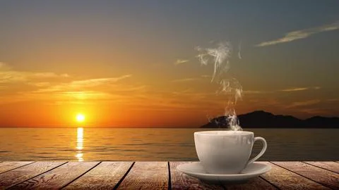 A hot coffee on the table on a natural background Stock Photos