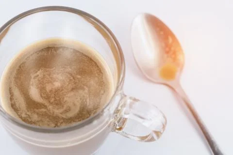 Hot coffee with teaspoon Stock Photos