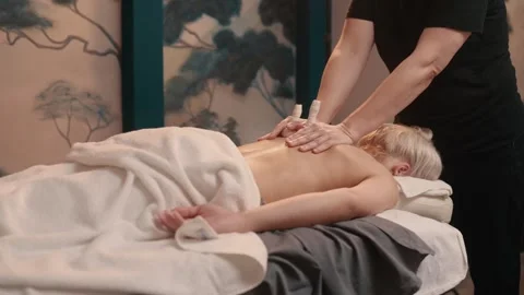 Hot compress massage with herbal sacks. Stock-Footage 343391914