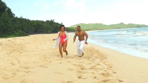 Hot couple flirting and making memories at the beach 動画素材 83689985
