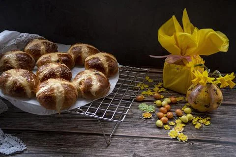 Hot  cross buns  in a  rustic  setting Stock Photos