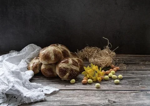 Hot  cross buns  in a  rustic  setting Stock Photos