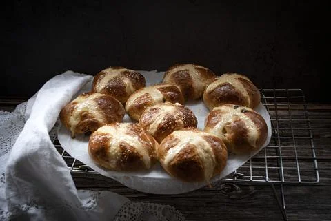 Hot  cross buns  in a  rustic  setting Stock Photos