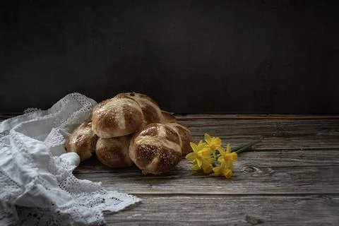 Hot  cross buns  in a  rustic  setting Stock Photos