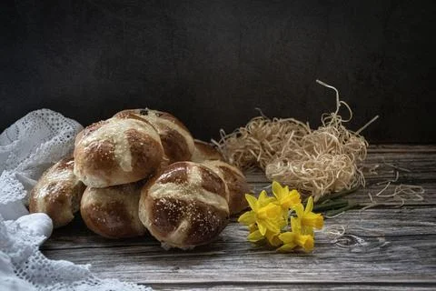 Hot  cross buns  in a  rustic  setting Stock Photos