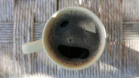 A hot cup of coffee on the table. A cup of instant coffee. A hot coffee Fotos de archivo