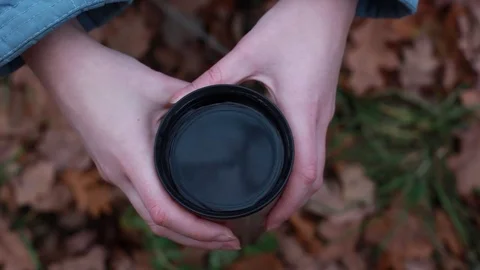 Hot cup of tea in hand Stock Footage 71125168