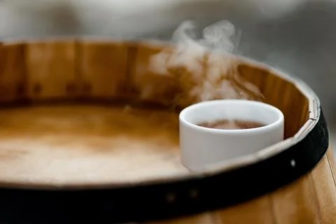 A hot cup of tea is on a table, the entourage of a Russian village Stock Photos
