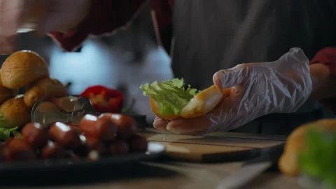 Hot Dog. A creative chef applies his skills and experience preparing a hotdo Stock Footage 275091095