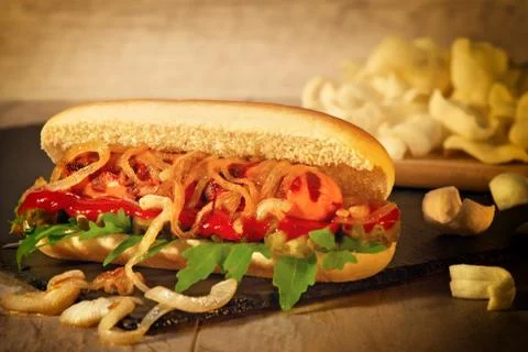 Hot dog with fried onions Stock Photos