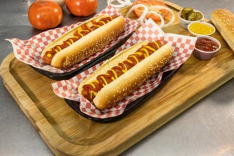 Hot dog prepared junk food fast food ketchup mustard epicurean dish Stock Photos