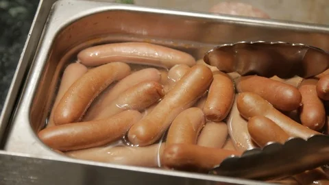 Hot dogs boiling in pan close up 動画素材 103550448