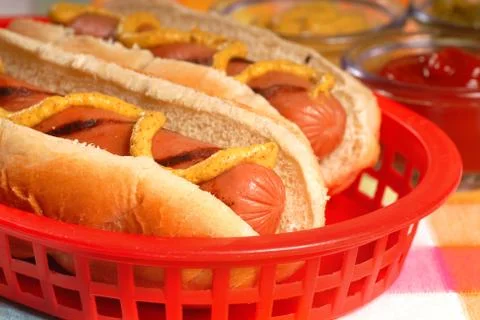 Hot dogs with condiments Stock Photos