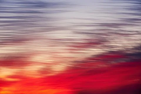 Hot dramatic sunset sky with pink, red and purple colors Stock Photos
