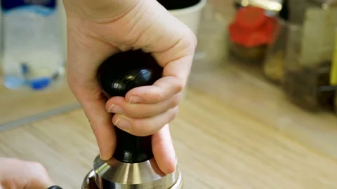 Hot drinks. Close-up of female hands making coffee in a shop. 4K 库存影片 87805717