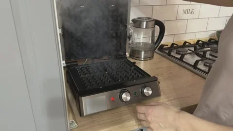 Hot Electric Waffle Maker Opening With Steam And Heat Cooking Process Close Video stock 336441133