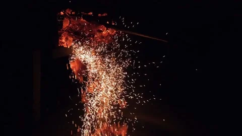 Hot embers on black background Stock Footage 148081101