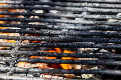 Hot empty barbecue BBQ grill with flaming fire and ember charcoal Stock Photos