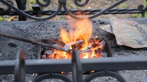 Hot forging blacksmith horse shoe fire Stock Footage 107790455