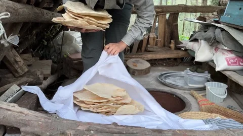 Hot fresh bread in bundle white cloth textile round circle cylinder clay Stock Footage 245470680